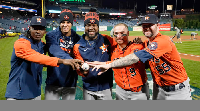 The four Astros pitchers—Cristian Javier, Bryan Abreu, Rafael Montero and Ryan Pressly—who threw a combined no-hitter in the World Series and their catcher Christian Vázquez pose for a photo.